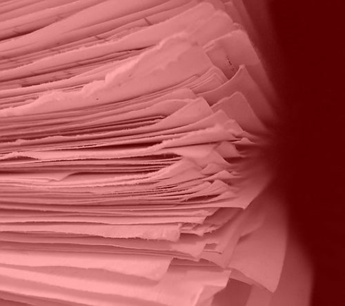 stack of papers tinted red