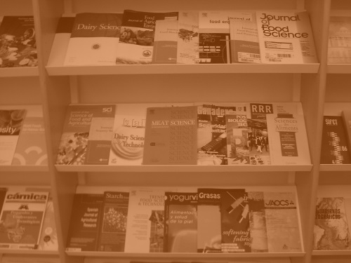 shelves of academic journals tinted orage